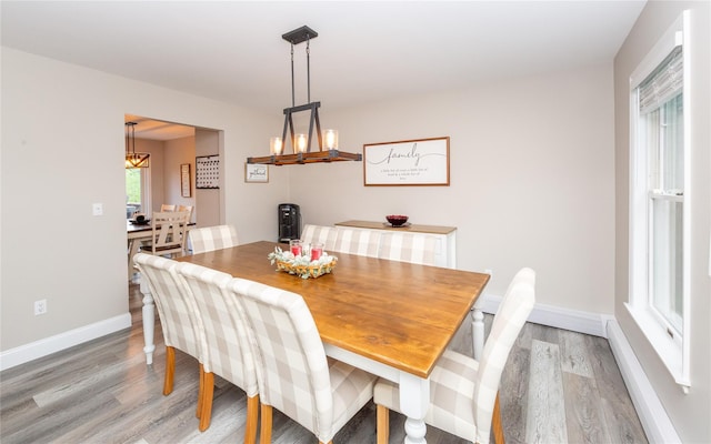 7 Glen Ct, Pawling, NY 12564 - dining area with light wood-type flooring and a chandelier
