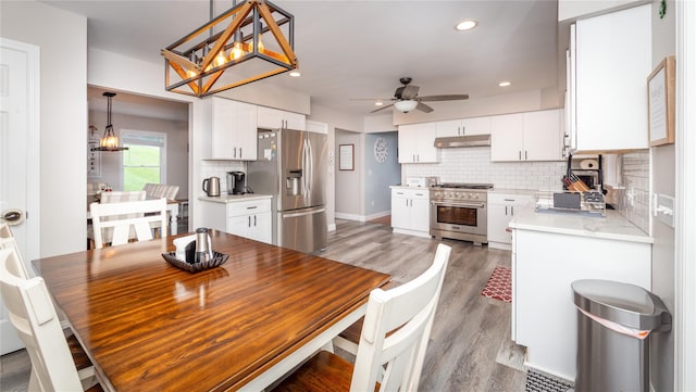 7 Glen Ct, Pawling, NY 12564 - dining area with light wood-type flooring, ceiling fan, and recessed lighting