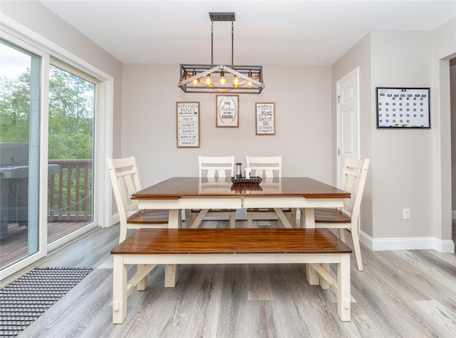 7 Glen Ct, Pawling, NY 12564 - dining room with light wood-type flooring and a chandelier