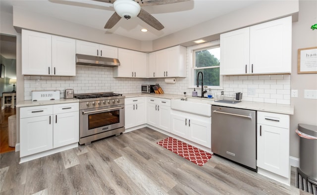 7 Glen Ct, Pawling, NY 12564 - kitchen with stainless steel appliances, under cabinet range hood, a ceiling fan, light wood-style floors, and recessed lighting