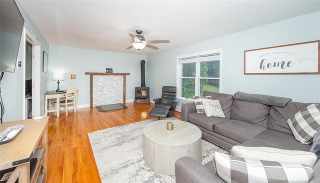 7 Glen Ct, Pawling, NY 12564 - living area with a wood stove, light wood-type flooring, and ceiling fan