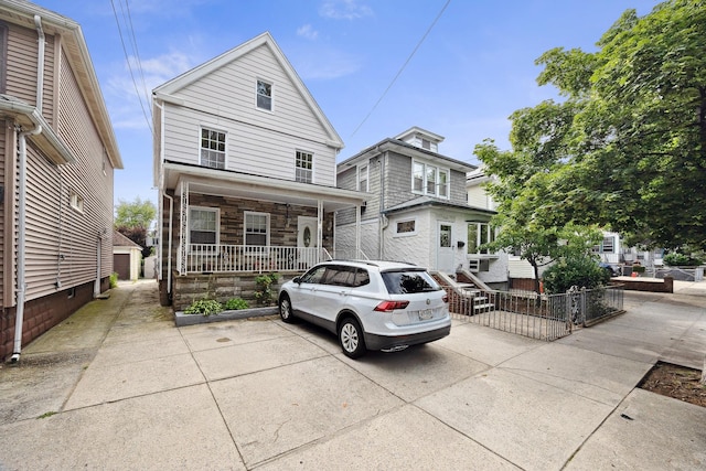 1639 Hone Ave, Bronx, NY 10461 - view of front facade featuring covered porch and stone siding