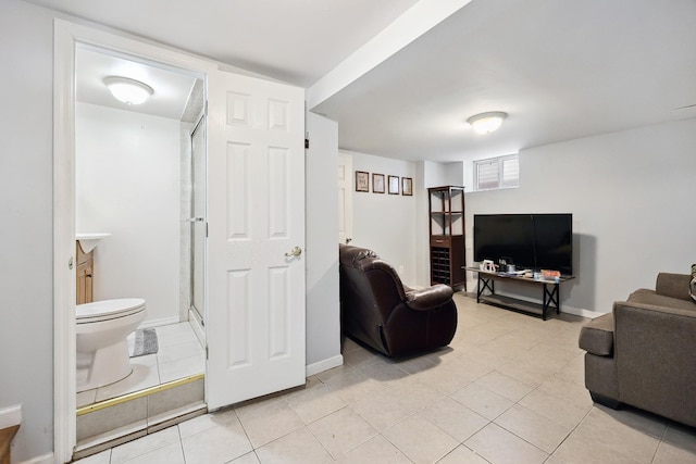 1639 Hone Ave, Bronx, NY 10461 - living area featuring light tile patterned floors and baseboards