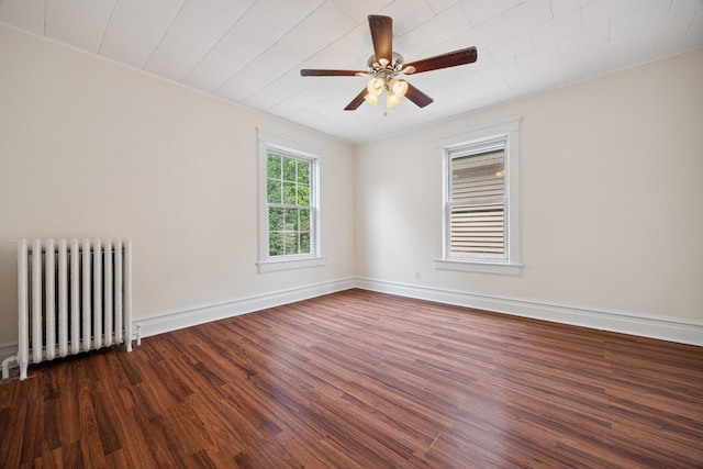 1639 Hone Ave, Bronx, NY 10461 - unfurnished room featuring radiator, dark wood-style flooring, and a ceiling fan