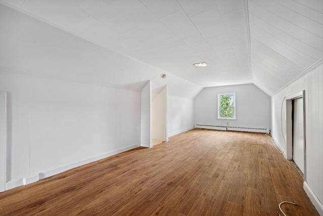 1639 Hone Ave, Bronx, NY 10461 - bonus room featuring baseboard heating, wood finished floors, and vaulted ceiling