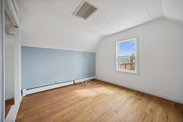 1639 Hone Ave, Bronx, NY 10461 - bonus room with baseboard heating, lofted ceiling, and wood finished floors