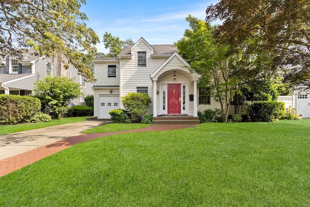 42 E Webster St, Merrick, NY 11566 - view of front of home featuring concrete driveway, a garage, a front lawn, and a shingled roof
