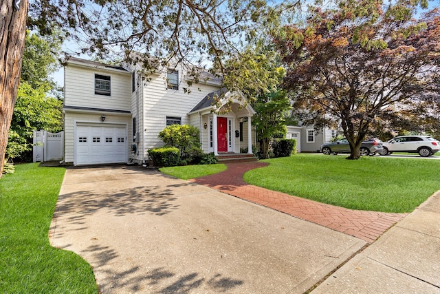42 E Webster St, Merrick, NY 11566 - traditional-style home with an attached garage and driveway