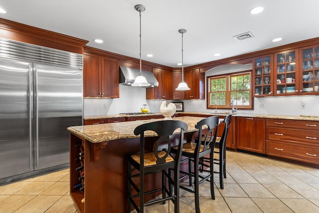 42 E Webster St, Merrick, NY 11566 - kitchen featuring stainless steel appliances, wall chimney exhaust hood, light tile patterned floors, glass insert cabinets, and recessed lighting