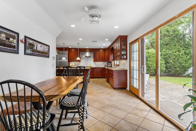 42 E Webster St, Merrick, NY 11566 - dining space with healthy amount of natural light, light tile patterned flooring, and recessed lighting