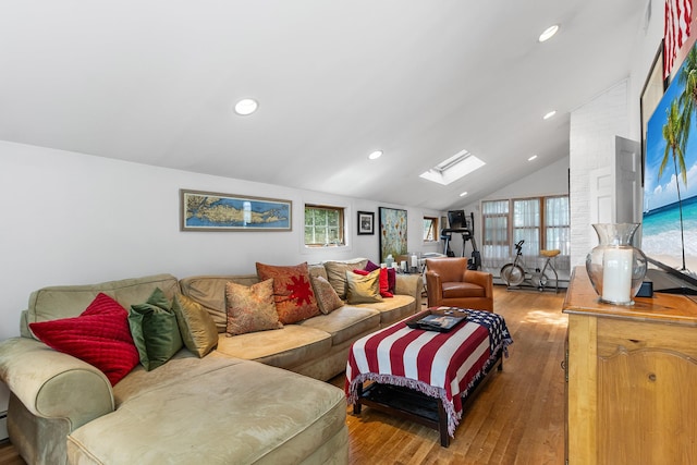 42 E Webster St, Merrick, NY 11566 - living room with a skylight, wood finished floors, vaulted ceiling, healthy amount of natural light, and recessed lighting