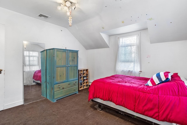 42 E Webster St, Merrick, NY 11566 - carpeted bedroom with vaulted ceiling and a baseboard heating unit