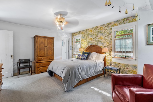 42 E Webster St, Merrick, NY 11566 - bedroom with multiple windows, carpet flooring, wallpapered walls, and a ceiling fan