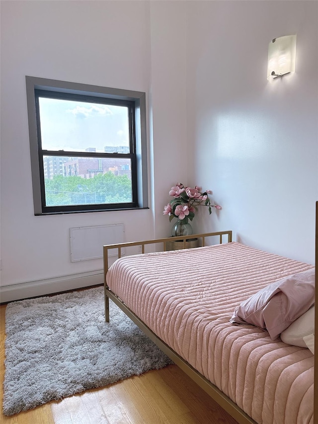 31-47 137th St Unit 3C, Flushing, NY 11354 - bedroom featuring wood finished floors and baseboards