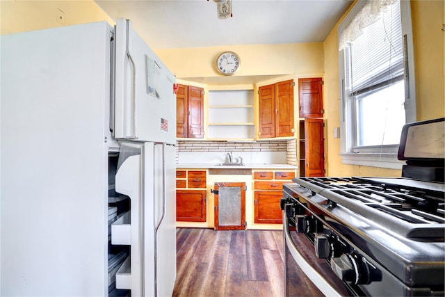 7914 Elks Rd, Elmhurst, NY 11373 - kitchen with stainless steel range with gas stovetop, open shelves, dark wood finished floors, light countertops, and brown cabinets