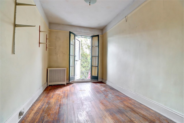 7914 Elks Rd, Elmhurst, NY 11373 - unfurnished room with radiator and hardwood / wood-style flooring
