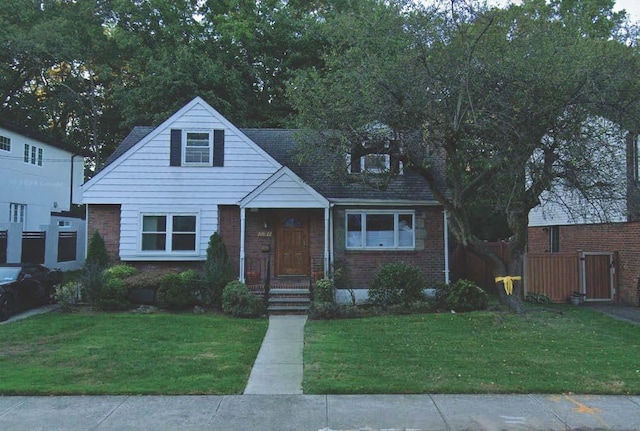 220-22 77th Ave, Oakland Gardens, NY 11364 - bungalow-style house featuring brick siding and a front lawn