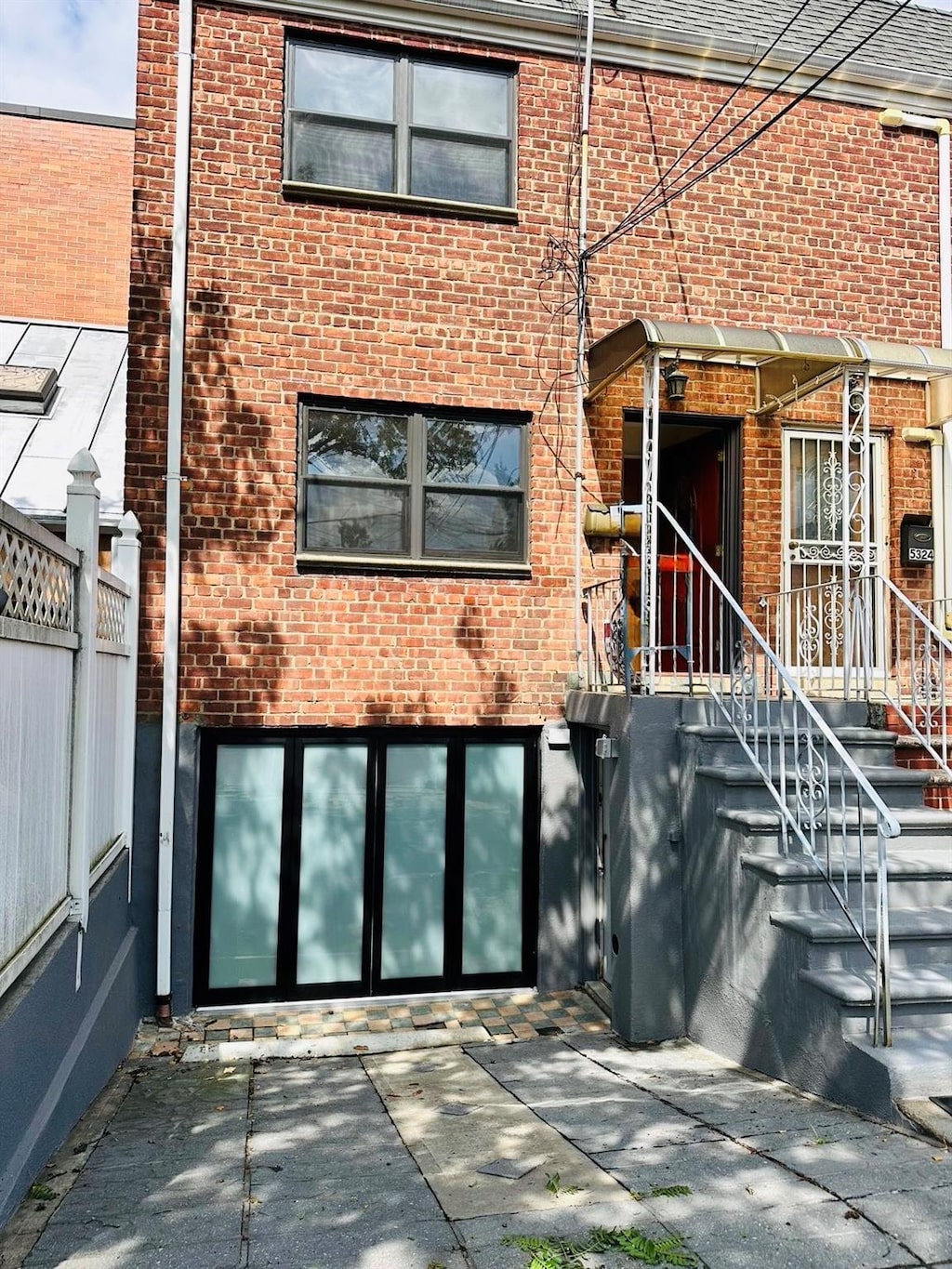 53-26 61st St, Maspeth, NY 11378 - doorway to property with brick siding