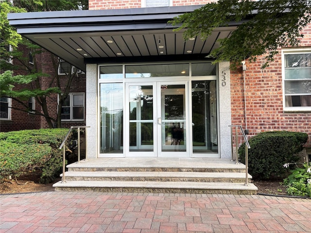 530 Dubois Ave Unit B3, Valley Stream, NY 11581 - view of exterior entry with french doors and brick siding