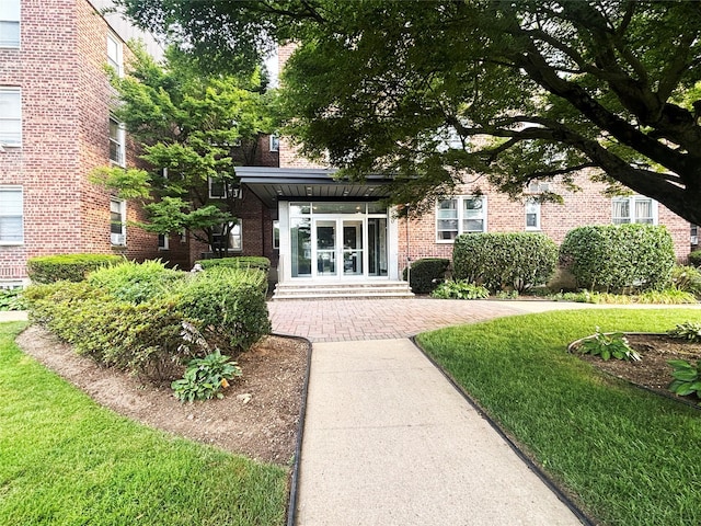 530 Dubois Ave Unit B3, Valley Stream, NY 11581 - entrance to property with brick siding and a yard