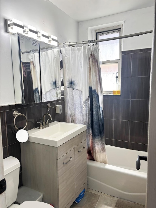 530 Dubois Ave Unit B3, Valley Stream, NY 11581 - bathroom with tile walls, vanity, shower / tub combo, and tile patterned floors