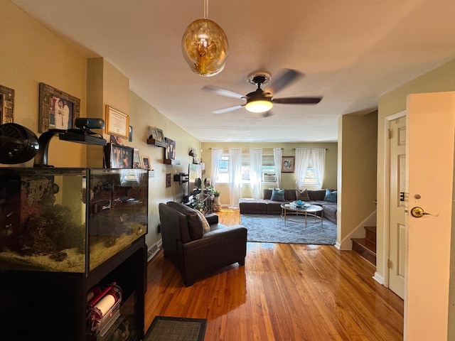 4406 Murdock Ave, Bronx, NY 10466 - living area featuring wood finished floors, ceiling fan, and stairs