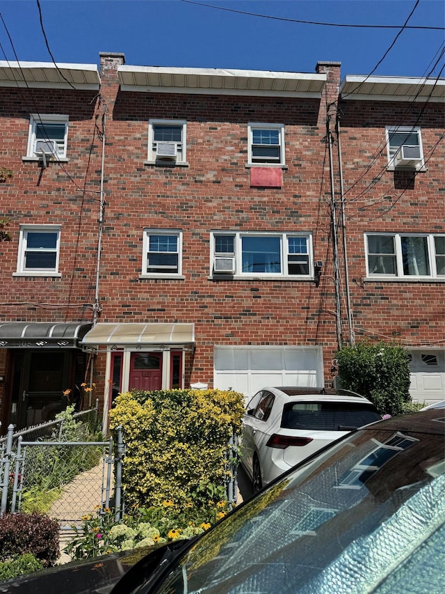 4406 Murdock Ave, Bronx, NY 10466 - view of building exterior with an attached garage