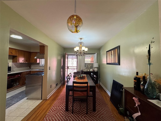 4406 Murdock Ave, Bronx, NY 10466 - dining area featuring a chandelier and light wood-type flooring