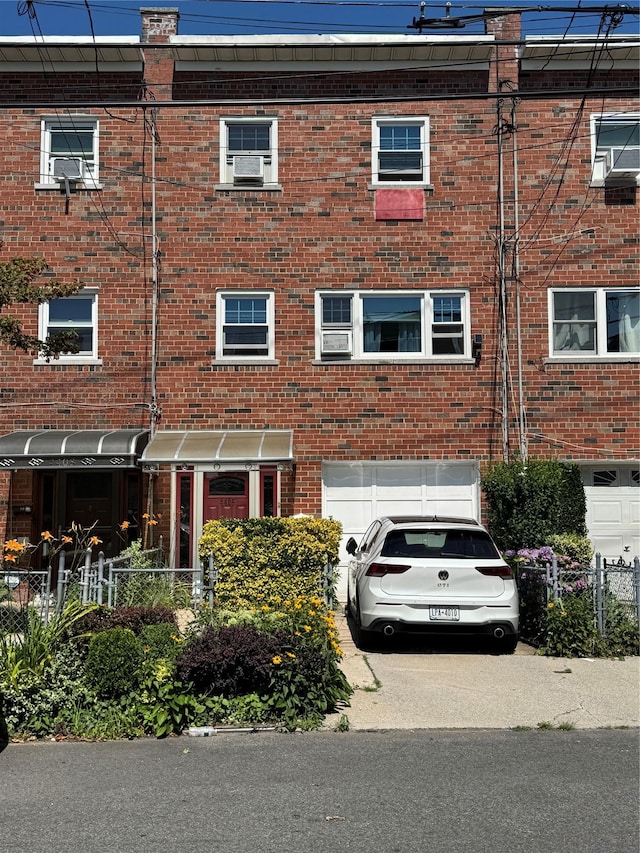 4406 Murdock Ave, Bronx, NY 10466 - view of building exterior featuring an attached garage and driveway