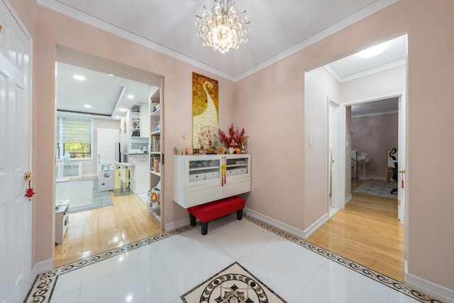 140-10 84th Dr Unit 2B, Briarwood, NY 11435 - hall with ornamental molding, a chandelier, and tile patterned flooring