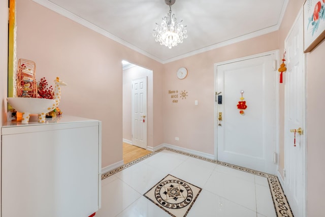 140-10 84th Dr Unit 2B, Briarwood, NY 11435 - foyer featuring light tile patterned floors, a chandelier, and ornamental molding