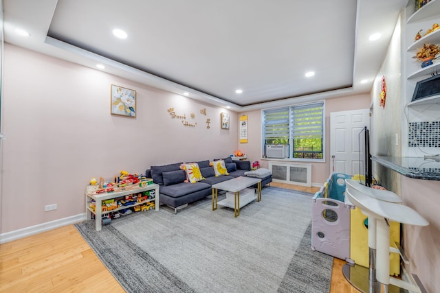 140-10 84th Dr Unit 2B, Briarwood, NY 11435 - living area with wood finished floors, recessed lighting, and a raised ceiling