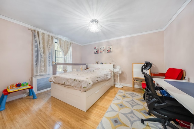 140-10 84th Dr Unit 2B, Briarwood, NY 11435 - bedroom featuring ornamental molding, wood finished floors, and a chandelier