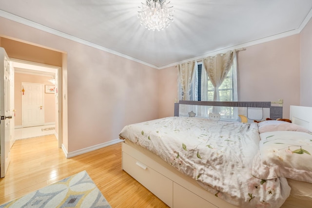 140-10 84th Dr Unit 2B, Briarwood, NY 11435 - bedroom featuring ornamental molding, light wood-style floors, and a chandelier