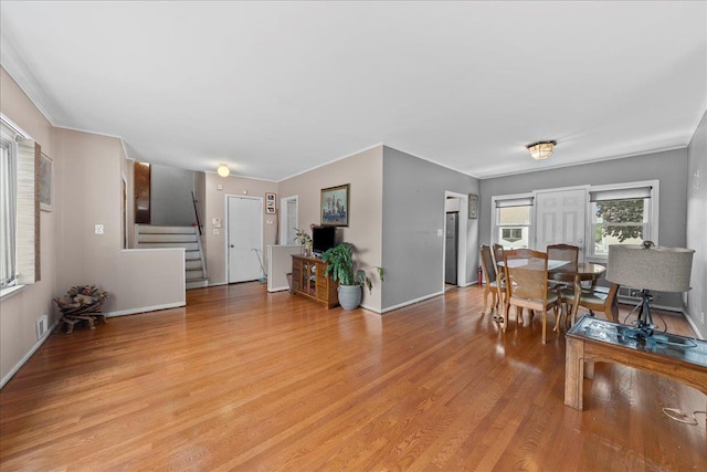 159 Branch Ave, Freeport, NY 11520 - living room featuring light wood finished floors and stairway