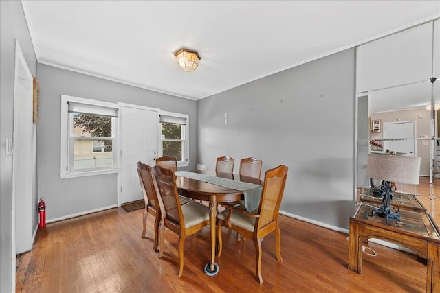 159 Branch Ave, Freeport, NY 11520 - dining room featuring wood finished floors and ornamental molding