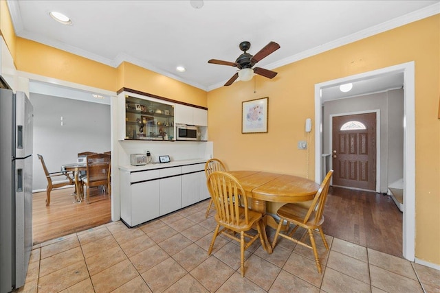 159 Branch Ave, Freeport, NY 11520 - dining area with ceiling fan, crown molding, light tile patterned floors, and recessed lighting