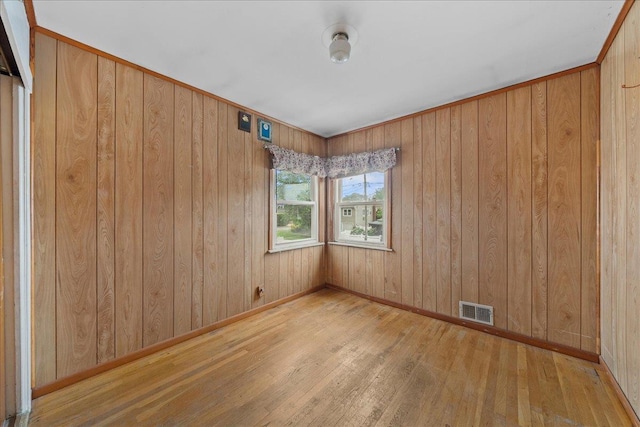 159 Branch Ave, Freeport, NY 11520 - empty room with wood-type flooring and wood walls