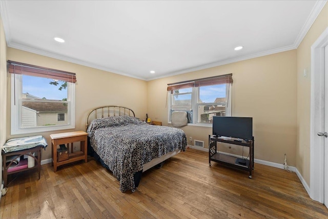 159 Branch Ave, Freeport, NY 11520 - bedroom featuring hardwood / wood-style flooring, ornamental molding, and recessed lighting