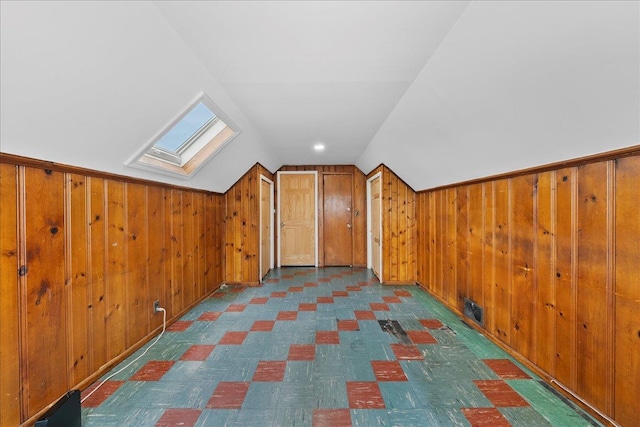 159 Branch Ave, Freeport, NY 11520 - bonus room featuring a skylight, wood walls, lofted ceiling, and tile patterned floors