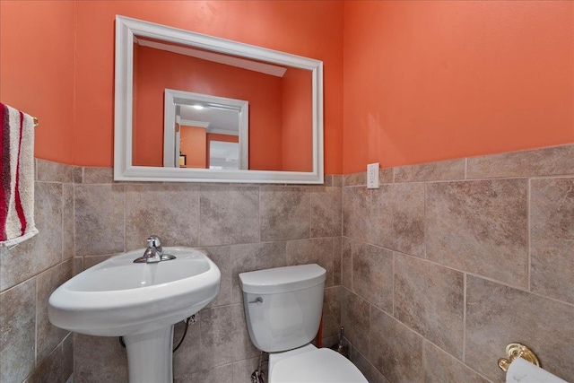 159 Branch Ave, Freeport, NY 11520 - bathroom featuring tile walls and a wainscoted wall