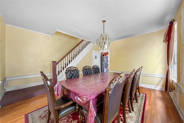 966 E 42nd St, Brooklyn, NY 11210 - dining space featuring a chandelier, stairway, wood-type flooring, and crown molding