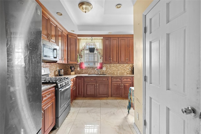 966 E 42nd St, Brooklyn, NY 11210 - kitchen with stainless steel appliances, light marble finish flooring, decorative backsplash, brown cabinets, and recessed lighting