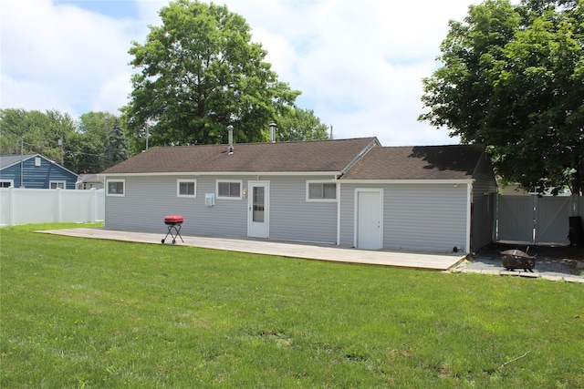 45 Tamarack St, Central Islip, NY 11722 - rear view of property featuring an outdoor fire pit, a deck, and roof with shingles