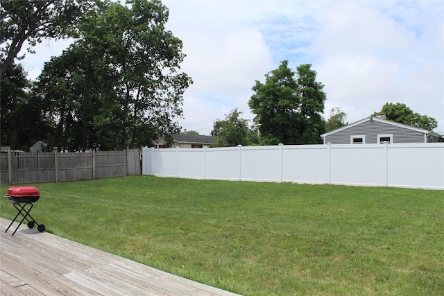 45 Tamarack St, Central Islip, NY 11722 - fenced backyard with a deck