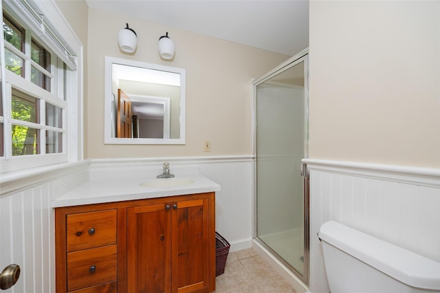 844 Salt Point Tpke, Pleasant Valley, NY 12601 - bathroom with a wainscoted wall, vanity, a decorative wall, a stall shower, and tile patterned floors