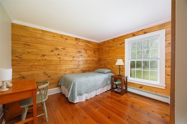 844 Salt Point Tpke, Pleasant Valley, NY 12601 - bedroom featuring baseboard heating, ornamental molding, hardwood / wood-style floors, and wooden walls