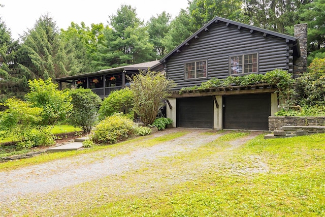 844 Salt Point Tpke, Pleasant Valley, NY 12601 - log cabin with driveway, a garage, log siding, and a chimney