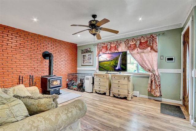 33 Breston Dr W, Shirley, NY 11967 - living area with a wood stove, ceiling fan, wood finished floors, brick wall, and recessed lighting