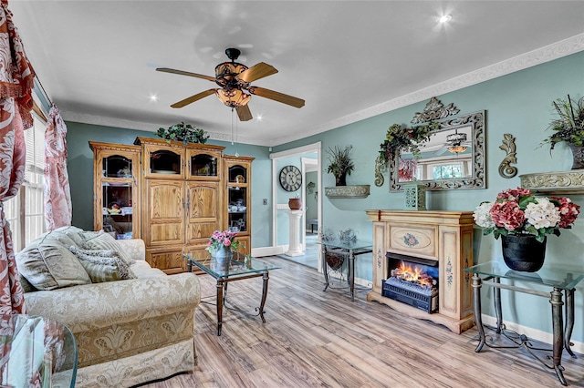 33 Breston Dr W, Shirley, NY 11967 - living area with ceiling fan, crown molding, light wood-style flooring, a warm lit fireplace, and recessed lighting